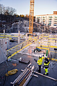 Two engineers working at construction site