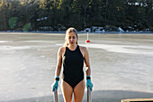 Woman preparing for swim at winter