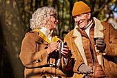 Senior couple having coffee outdoor