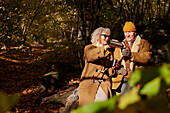 Senior couple having coffee outdoor