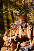 Senior couple having coffee outdoor