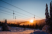 View of ski lift at sunset