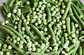 Heap of frozen green beans and peas