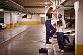 Man and woman checking air duct