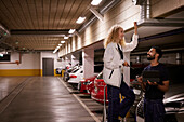 Man and woman checking air duct