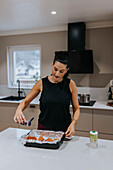 Woman preparing food in kitchen