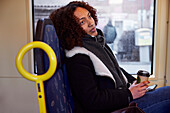 Young woman sitting in bus