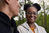 Smiling woman talking to friend