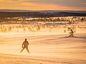 Silhouette of skier at sunset