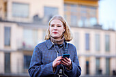 Smiling woman using cell phone