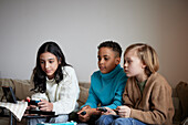 Children playing video games at home