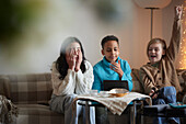 Children playing video games at home