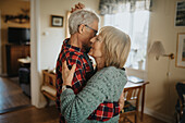 Senior couple dancing at home