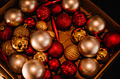 Close-up of various Christmas baubles in box