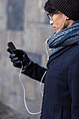 Handsome man with smartphone on street