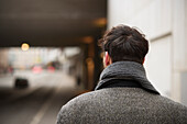 Rear view of man walking in street