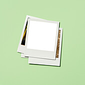 Stack of instant pictures with blank on top