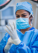 Female doctor preparing for surgery in operating theater