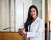 Portrait of female doctor at reception desk