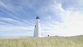 USA, Massachusetts, Nantucket Island, Woman waving by Great Point Light
