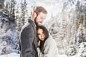 United States, Utah, American Fork, Couple hugging in Winter landscape