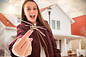 Smiling girl (12-13) with dragonfly on finger