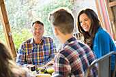 Family with son (12-13) talking at dining table