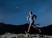 United States, Utah, Alpine, Man jogging in mountains at night