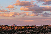 United States, New Mexico, Lamy, Colorful sky over Galisto Basin Preserve at sunset