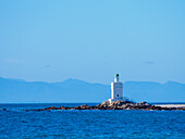 South Africa, Western Cape, St Helena, White lighthouse on sea coast