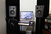 Mixing console and speakers in recording studio