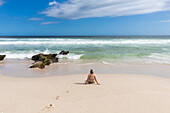 South Africa, Western Cape, Girl (16-17) relaxing on beach in Lekkerwater Nature Reserve
