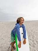 Boy (8-9) with body board on Grotto Beach