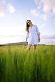 Young woman standing in agricultural field