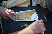 Person preparing tamales, close up