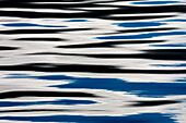 USA, Alaska, Craig. Reflection in rippled water
