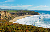 Half Moon Bay, California, cliffs off of the Ritz Golf Course with waves sand at Half Moon Bay Golf Links