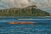 USA, Hawaii, Oahu, Honolulu, Diamond Head, Group practices rowing in an Outrigger canoe.