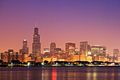 USA, Illinois, Chicago. Sunrise skyline and Lake Michigan