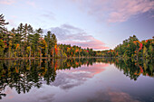 Fall colors on shoreline of Irwin Lake, Hiawatha National Forest, Alger County, Upper Peninsula of Michigan.