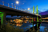 USA, Oregon, Portland. Tilikum Bridge Crossing and The Portland Spirit boat on Willamette River