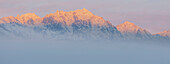 USA, Washington State, Mount Constance. Foggy sunrise panorama of mountain