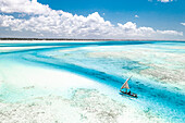 Overhead view of tourist boat on coral reef in the exotic lagoon, Paje, Jambiani, Zanzibar, Tanzania, East Africa, Africa