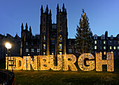 Edinburgh Christmas tree and sign in front of the New College, the Mound, Edinburgh, Scotland, United Kingdom, Europe