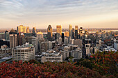 View of Montreal city skyline from Mont Royal Park in autumn at sunset, Montreal, Quebec, Canada, North America