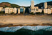 Aerial drone view of Leme Beach and Copacabana Beaches at sunrise with Princesa Isabel Avenue at centre, UNESCO World Heritage Site, Rio de Janeiro, Brazil, South America