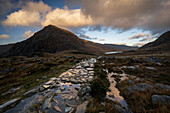 Stone footpath leading towards Llyn Ogwen with view of Tryfan in Snowdonia National Park, Ogwen, Conwy, Wales, United Kingdom, Europe