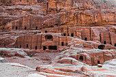 Caves carved in the stone of the mountain inside, Petra, UNESCO World Heritage Site, Jordan, Middle East