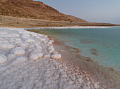Salty shore and turquoise water of the Dead Sea, Jordan, Middle East
