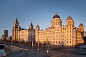 Evening Light on The Pier Head featuring the Royal Liver Building, the Cunard Building and Port of Liverpool Building, Liverpool Waterfront, Liverpool, Merseyside, England, United Kingdom, Europe